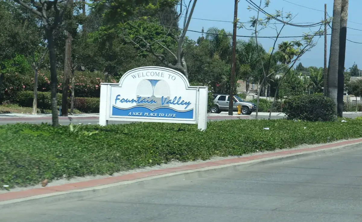 The Welcome to Fountain Valley city monument sign on a roadside in Fountain Valley CA