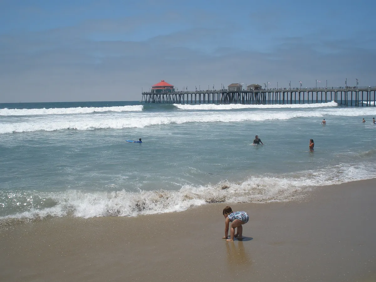 Huntington Beach Municipal Pier and the surf line in Huntington Beach CA