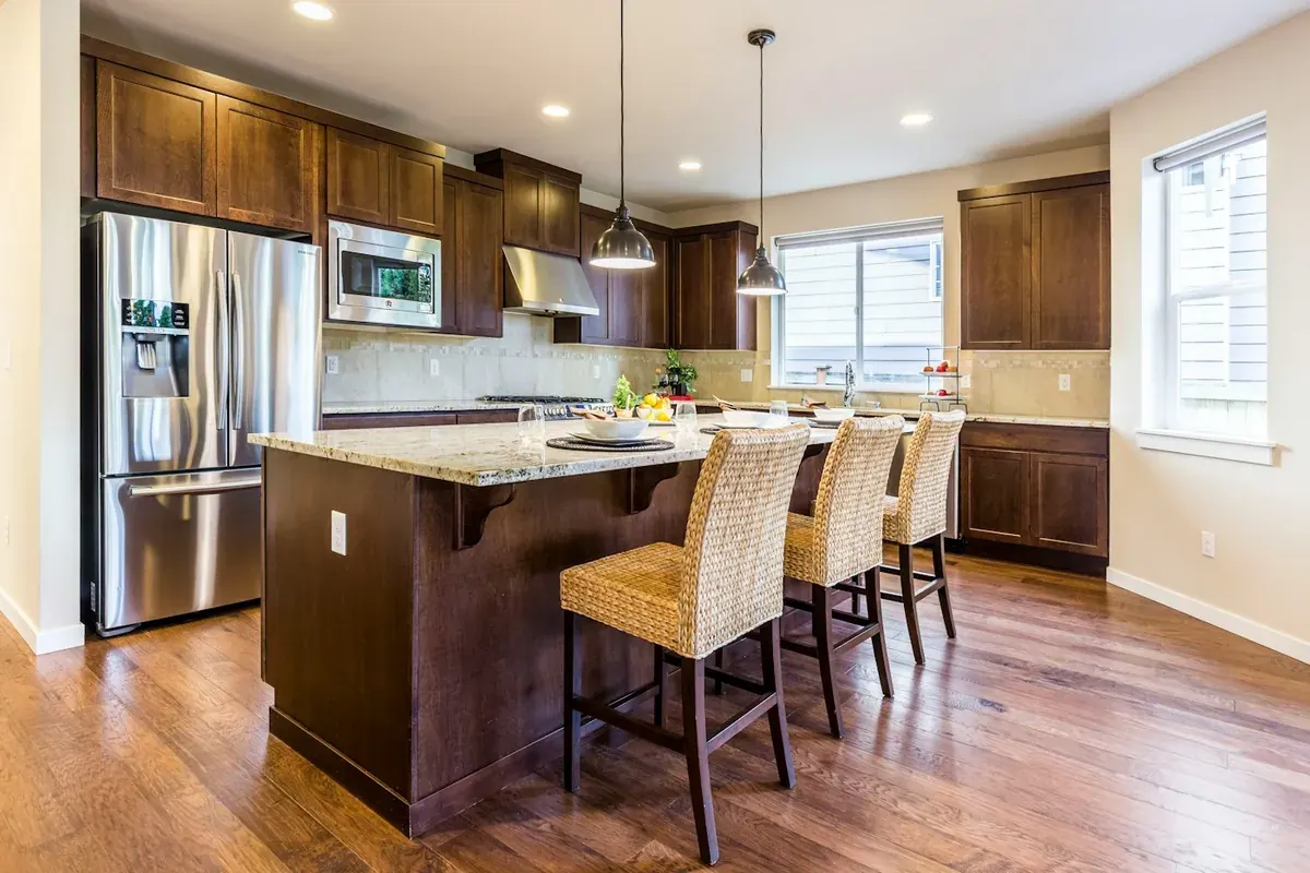 Stained wood kitchen cabinets with granite counters in a Westminster CA area home